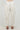 Women’s ivory barrel leg pants with oversized side pockets and tapered ankle.