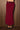 Women’s burgundy maxi skirt with sparkling sequin waistband and sleek flowing silhouette.