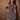 Women’s charcoal plaid sleeveless romper with smocked fitted bodice and flowy skirt-style shorts.