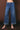Women's medium wash high-rise wide leg jeans with oversized cuffed hem.