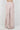 Women’s blush pink wide leg pants with asymmetric wrap front and adjustable side tie.
