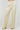 Beige wide-leg pants on a plain background