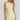 Woman wearing a light yellow dress with a plain background