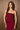 Women’s burgundy strapless fitted top with tonal sequin trim along the neckline and hem.