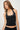 A women's black halter cami featuring a flattering scoop neckline with silver grommet accents, a fitted stretch silhouette, and soft knit fabric. This boutique-inspired top is perfect for concerts, date nights, vacations, and elevated everyday style.