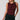 Women's burgundy sleeveless knit top featuring a draped crew neckline, ruched waist, and fitted silhouette.