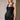 Women’s black satin sleeveless top with sheer floral lace neckline and lace bust detailing.