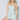 Woman wearing a light blue sequin dress against a white background
