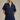 Woman wearing a denim outfit on a beige background