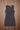 Women’s sleeveless burgundy and charcoal plaid mini dress with black polka dot detailing.