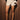 Women’s cream and taupe striped high-waisted shorts with wide wrap tie waistband.