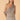 Women’s brown and cream gingham one-shoulder top with asymmetric draped overlay detail.