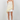 Woman wearing a white lace top and shorts on a white background
