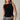 Women's black ribbed sleeveless sweater tank with side button detail and asymmetrical hem.
