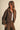 Women’s chocolate brown jacket with tiny golden floral print, oversized collar, patch pockets and button front.