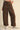 Women’s chocolate brown wide leg pants with tiny golden floral print and oversized cuffed hems.