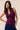 plum knit vest

purple sleeveless knit top

women’s button up vest

gold button vest

chic layering pieces

tailored knit vest

trendy women’s knitwear

work to weekend outfit

modern v-neck vest

Layer women’s clothing